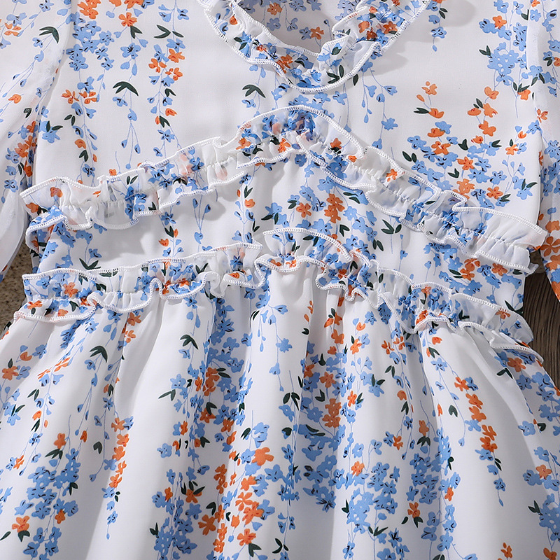 Flickklänning med blommor och lång ärm prinsessmodell_voghion.com