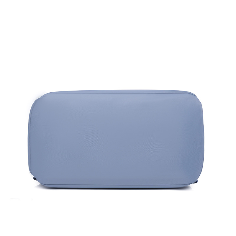 Comercio exterior al por mayor 2023 verano nuevas señoras mochila de nailon moda contraste color borla mochila de viaje de doble uso marea