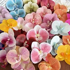 シミュレーション3dゴム胡蝶蘭の花の頭のお土産の服の装飾の精巧な結婚式の装飾品の偽の花のdiyの頭の飾りの花