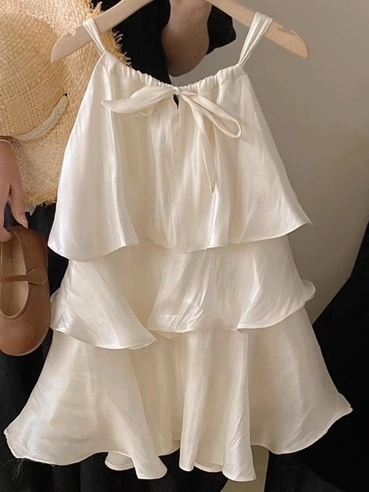 Xianning siete ropa para niños 25 verano nuevo vestido de temperamento dulce para niñas falda de tirantes de pastel con volantes de alta gama