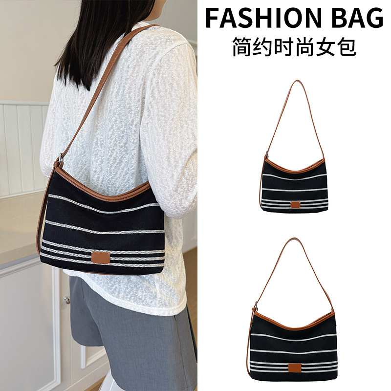 Cross-border women's 2026 new autumn collection: a trendy, color-blocked, versatile striped canvas bucket bag, perfect for carrying on the shoulder or as a crossbody bag