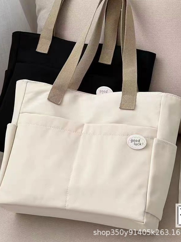 Diseño original bolso de tote de lona gruesa con cremallera japonesa para viajeros, bolso de hombro simple para estudiantes de arte informal