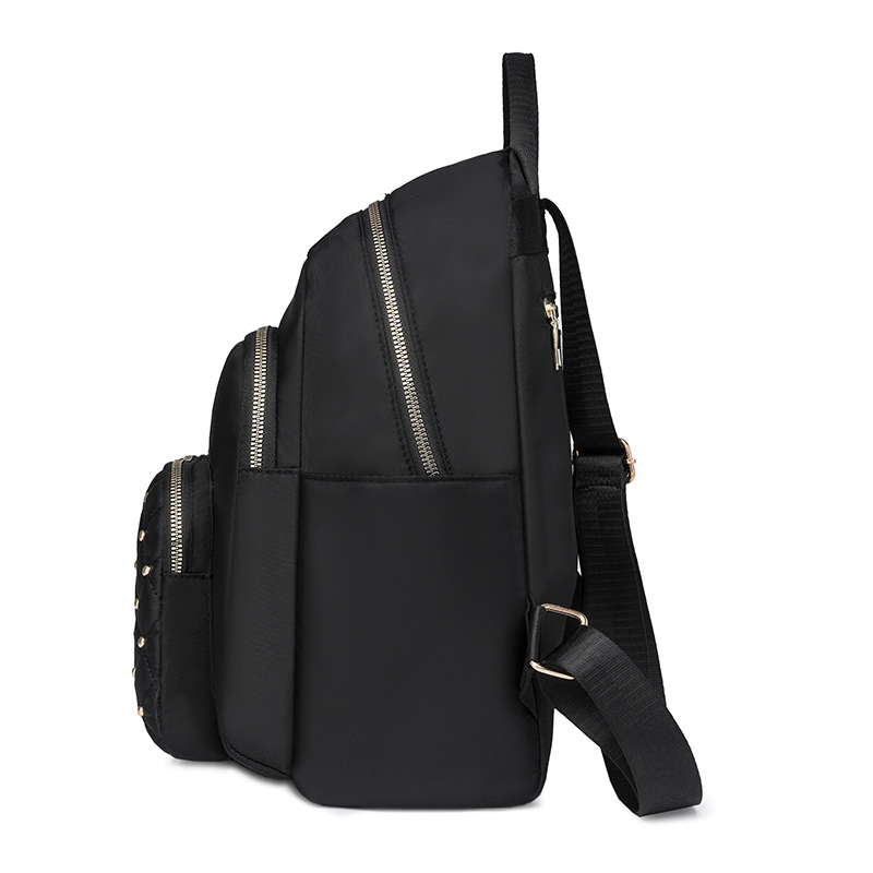 Comercio exterior al por mayor 2024 nuevo estilo casual señoras Lingge mochila moda remache color contraste mochila ligera mochila escolar marea