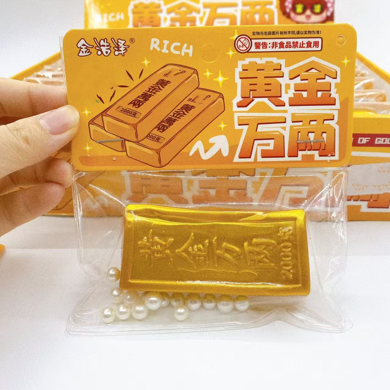 Simulación de oro pellizco pellizco Le Jinyuanbao descompresión rebote lento juguetes creativos novedad fluido pellizco mano al por mayor