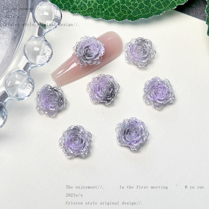 Nueva joyería de uñas de estilo gris-púrpura salvaje de estilo ins mezclada luminosa tridimensional de flores pequeñas accesorios de armadura al por mayor