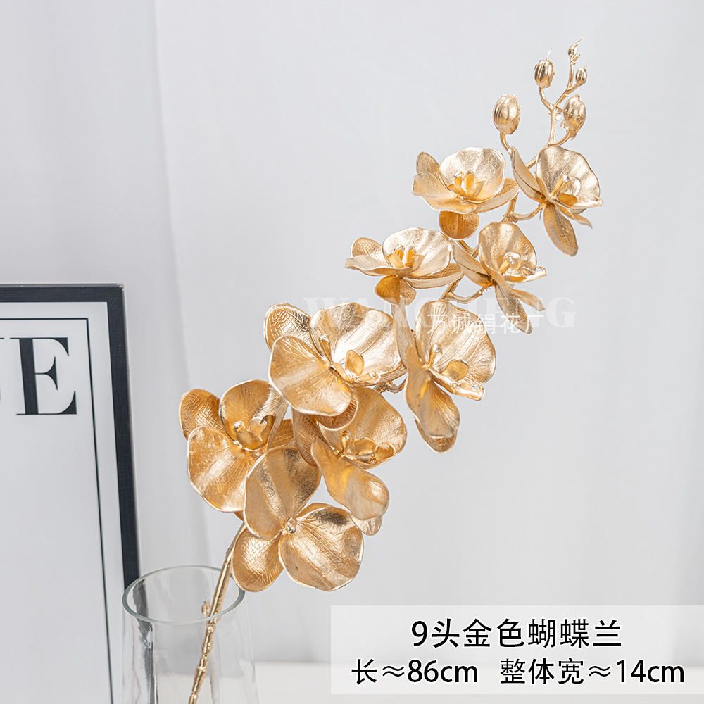 Flores artificiales doradas para Navidad