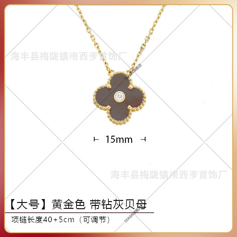 Large four-leaf clover necklace in gold and gray mother-of-pearl with diamonds in the middle