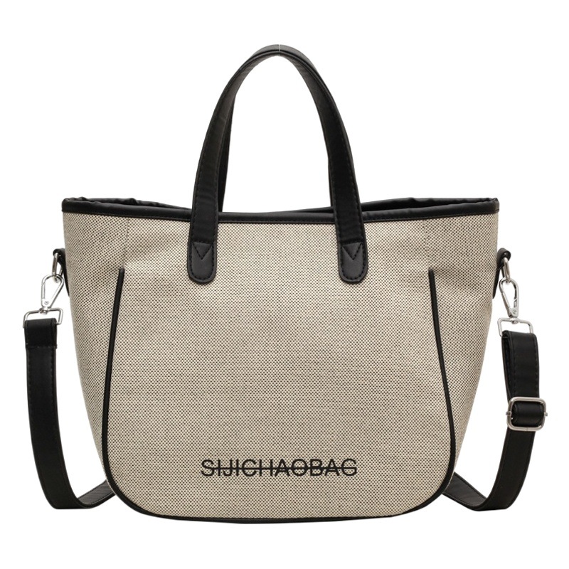 Estilo coreano de moda de contraste de color lienzo bolsa de mano portátil para las mujeres 2023 transfronteriza nueva textura de alto grado de hombro bolsa de mensajero