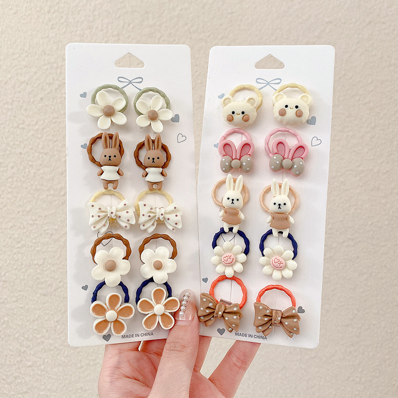 Los niños de la banda del pelo del bebé de la historieta no lastiman la banda de goma del pelo de la niña volumen del pelo menos cuerda del pelo del bebé