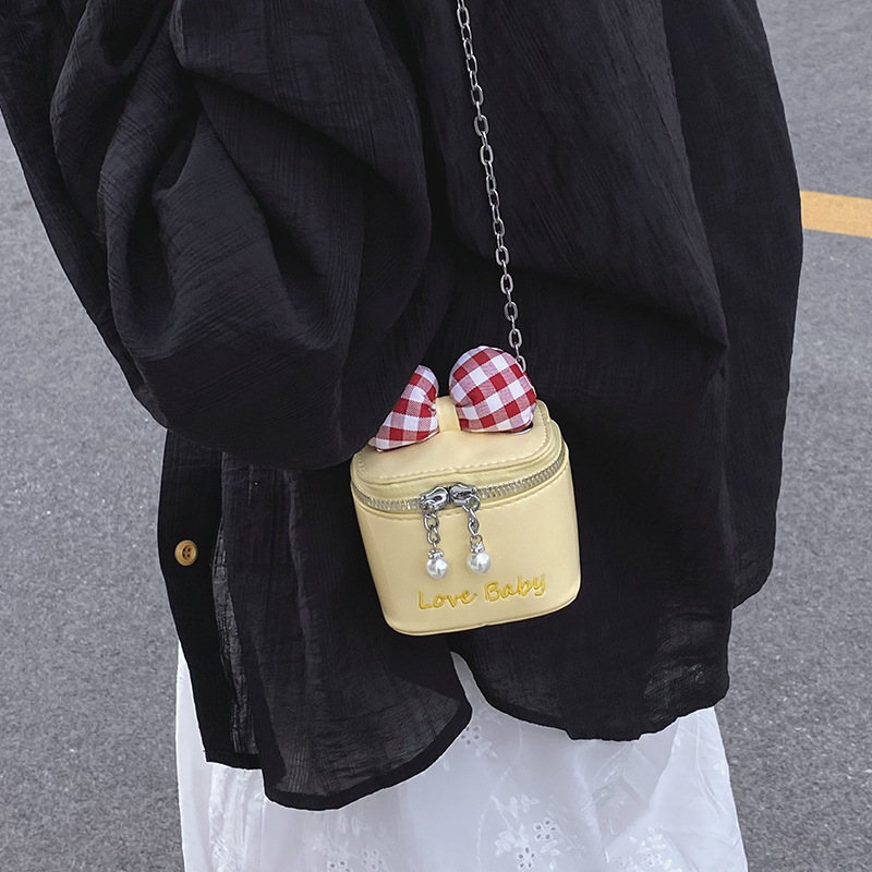 Bolso de cubo de moda coreana 2025 verano nuevo bolso femenino lindo lazo bolso de hombro mini cadena bolso de mensajero