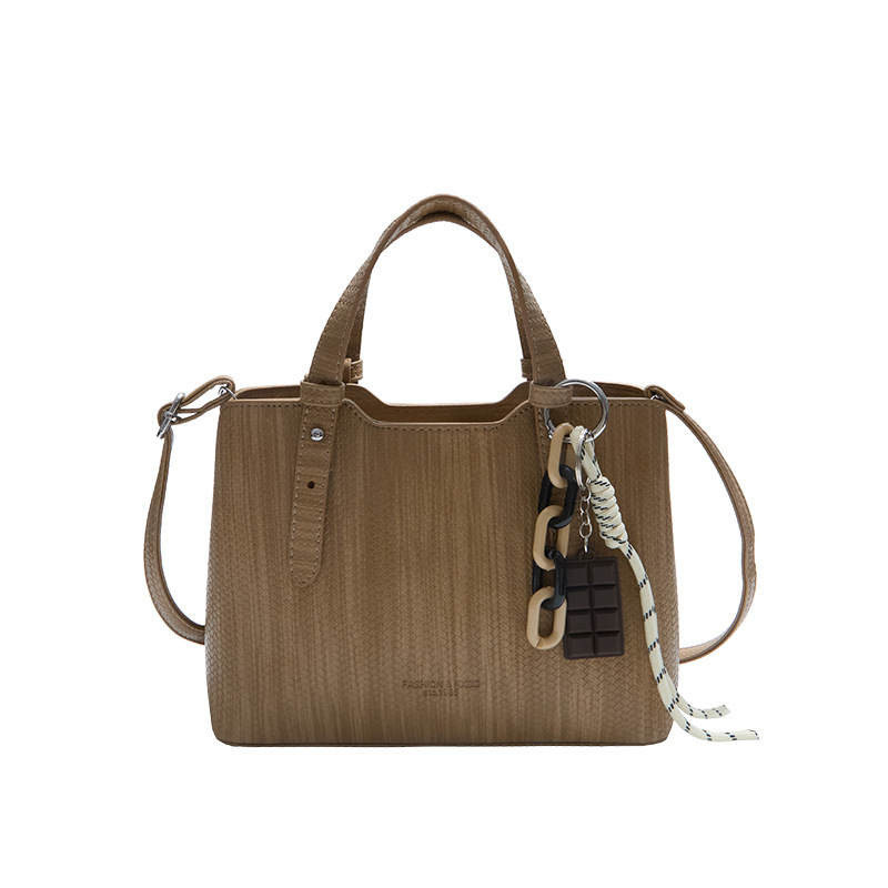 Texturas casuales bolsas de mano para mujeres otoño y invierno 2025 nueva moda simple bolsas de hombro versátiles retro mochila