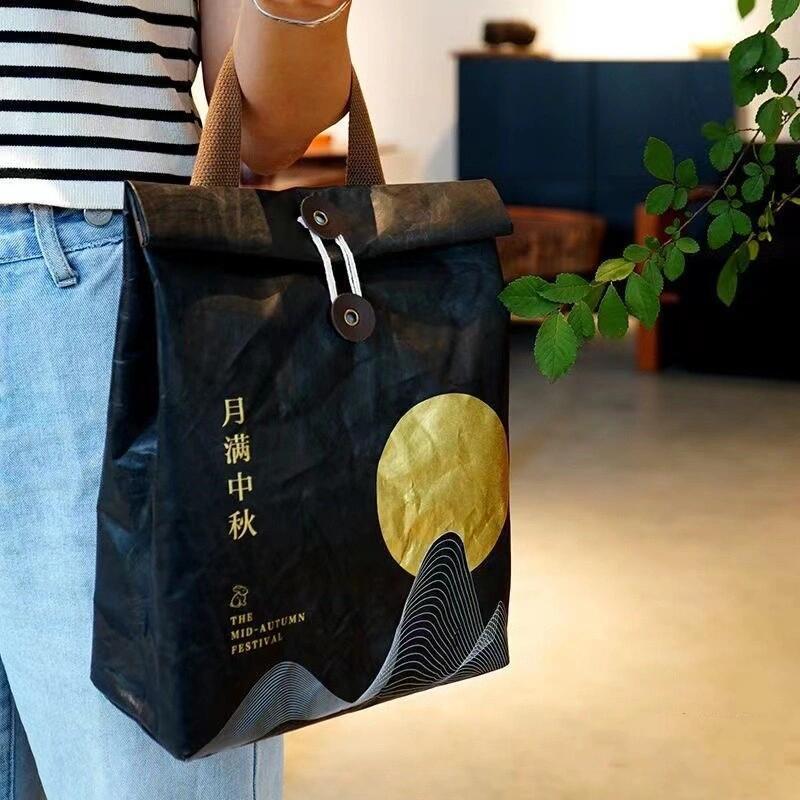 节日杜邦纸袋创意员工礼物手拿杜邦袋企业周年庆礼品杜邦纸包定制