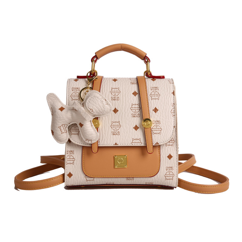 Mochila de moda coreana para mujer, bolso de mensajero con estampado de moda ringge de estilo occidental, bolso de viaje con colgante de cachorro lindo