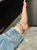 White bracelet, watch strap, cat's eye