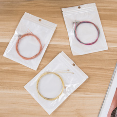A set of six acoustic guitar strings, including guitar strings for the first, second, and third strings, loose strings, rust-resistant, and break-resistant.