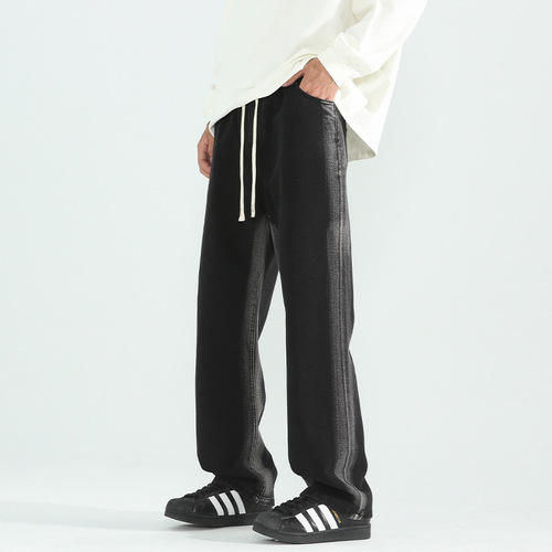 Vintage-style distressed washed denim jeans for men—trendy, loose-fit, straight-leg casual trousers for spring and autumn