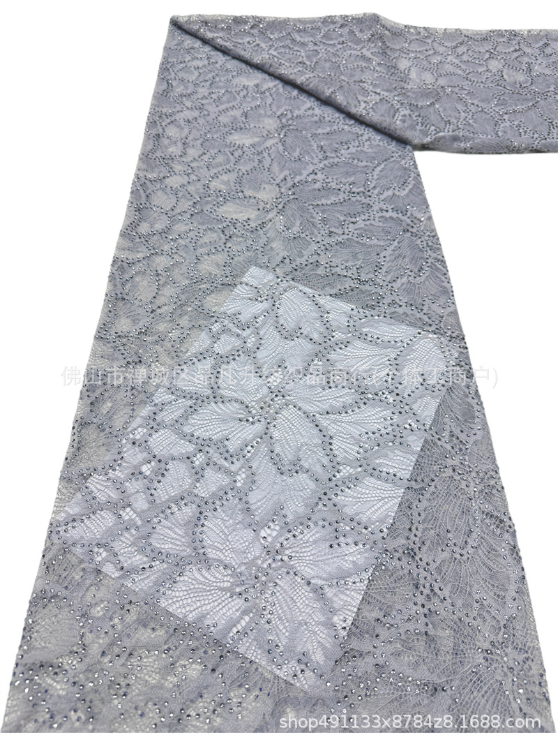 Nuevo hueco flor de encaje fondo tela de perforación caliente pesada cola de pez vestido de boda vestido de noche brindis tela spot