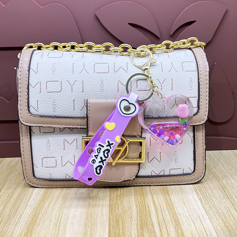 Petróleo amor tulipas llavero estereoscópico muñeca exquisita pareja colgante bolsa de automóvil garra máquina regalos al por mayor