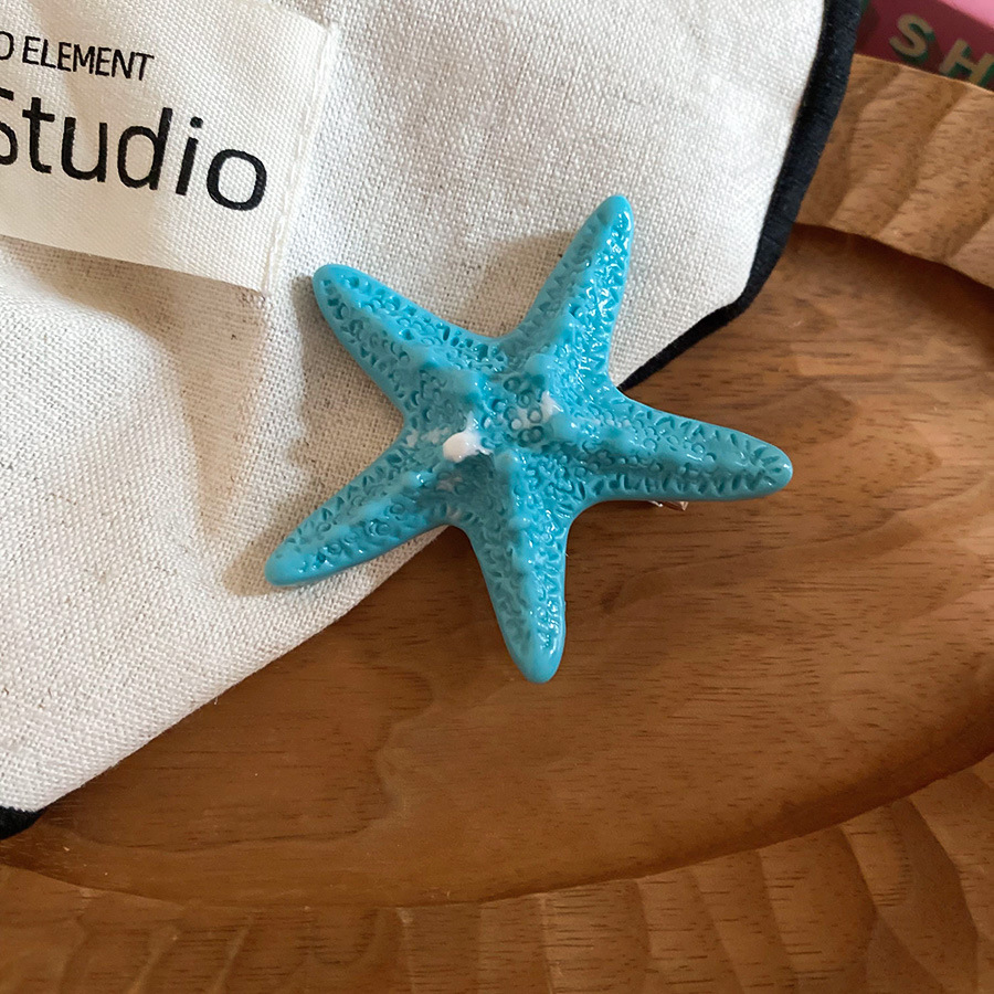 Vacaciones junto al mar viento estrella de mar horquilla moda tendencia de fotografía lateral clip de pico de pato sentido de alta gama accesorios para el cabello de todo fósforo mujeres