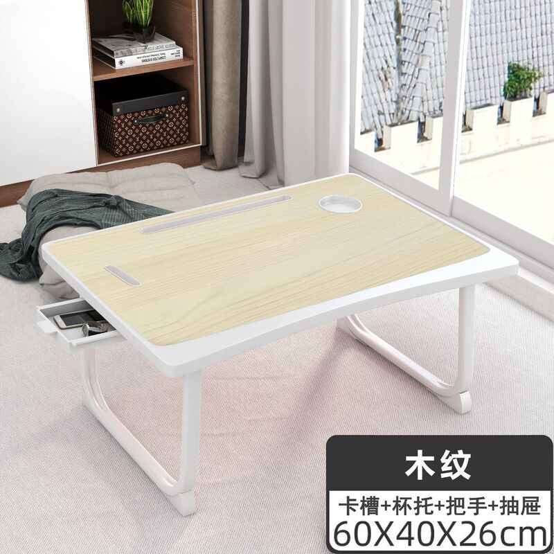ベッドの上の机のノートパソコンの机は折りたたみ可能です。|undefined