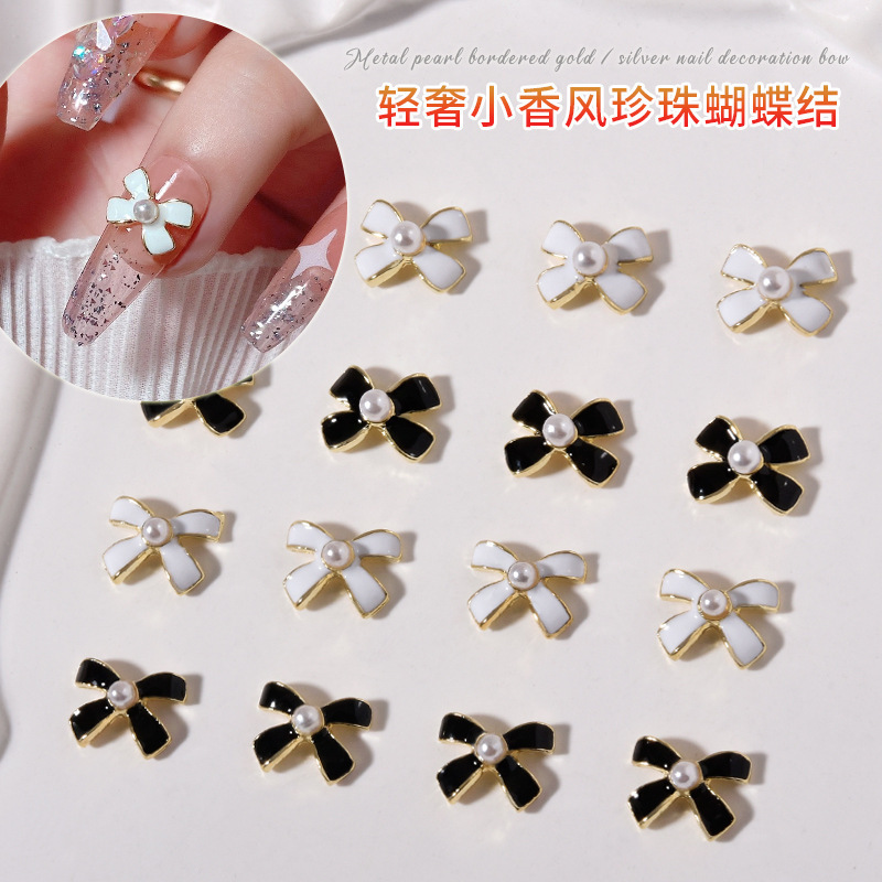 New online celebrity Chanel style nail alloy jewelry dripping Pearl bow black and white simple French nail decoration New online celebrity Chanel style nail alloy jewelry dripping Pearl bow black and white simple French nail decoration