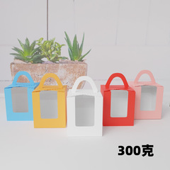 Packaging box for cupcakes, muffins, tartlets, and baked desserts, featuring a handle and a window design, suitable for single or double pieces.