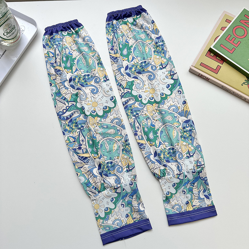 Mangas de protección solar para mujeres de verano nuevo estilo al aire libre anti-UV patrón de montar mangas de brazo de impresión de viento elegante