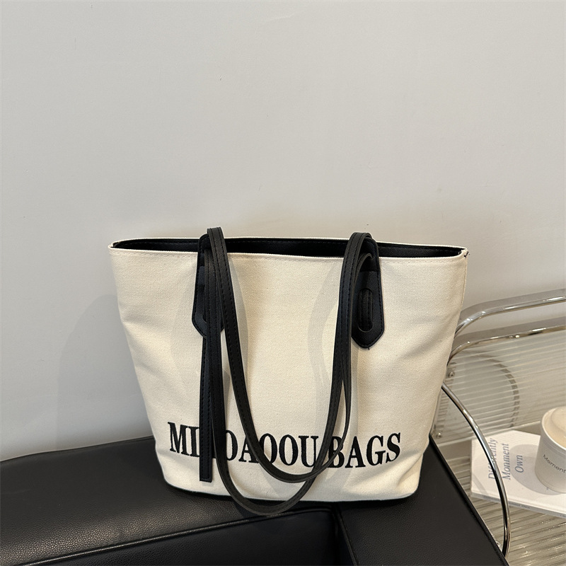 Bolsa de gran capacidad para mujeres 2024 otoño nuevo estilo de bolsa de lona universal bolso de hombro de viaje de estudiantes universitarios bolso de clase