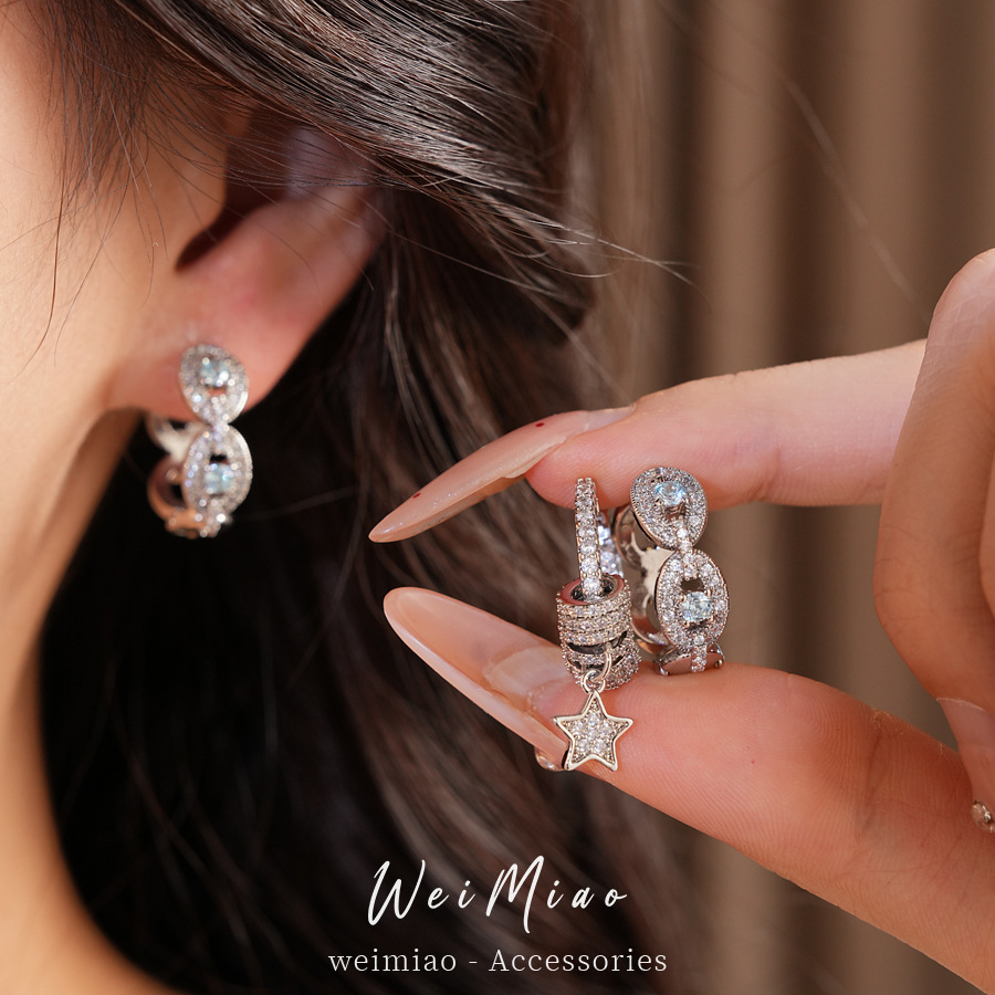 Zircon estrellas redondas huecos perfiles de aretes de estilo de estilo personales de nicho ligero lujo alta sensación auriculares al por mayor