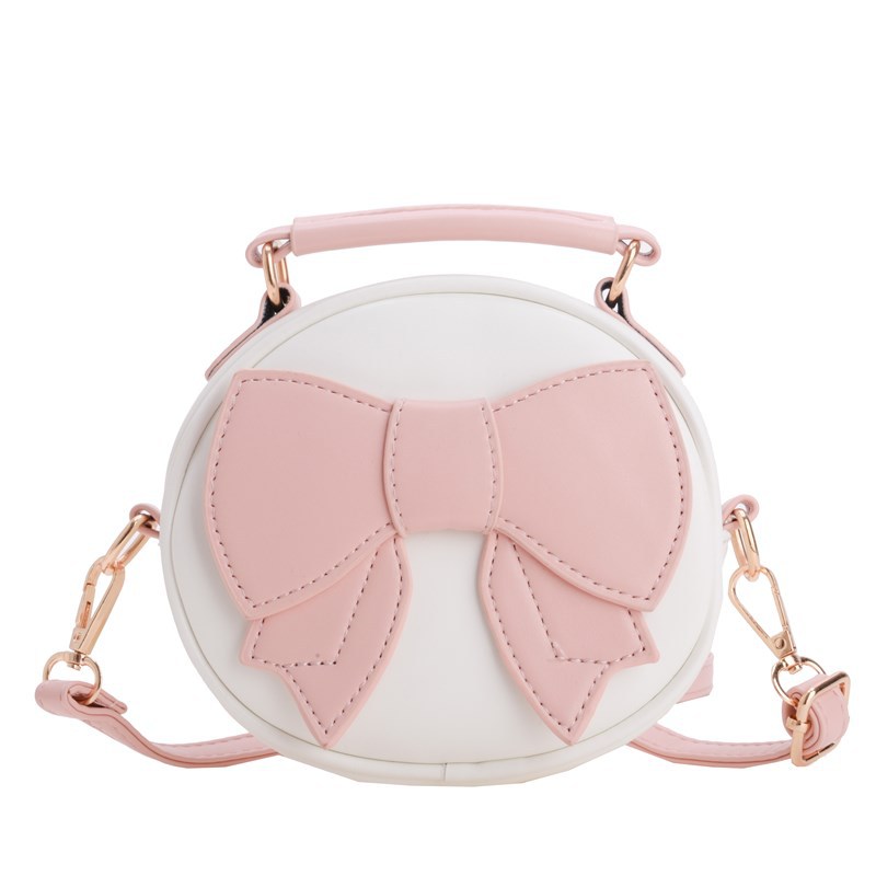 Bolsos para niños mini lindos arcos para hombres y mujeres, bolsos redondos para niños 2025 moda coreana nueva bolsa de cambio para niños