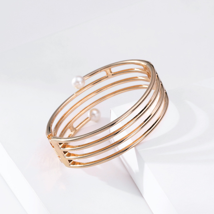 simple multi-layer hollow line-shaped double-headed pearl gold bracelet