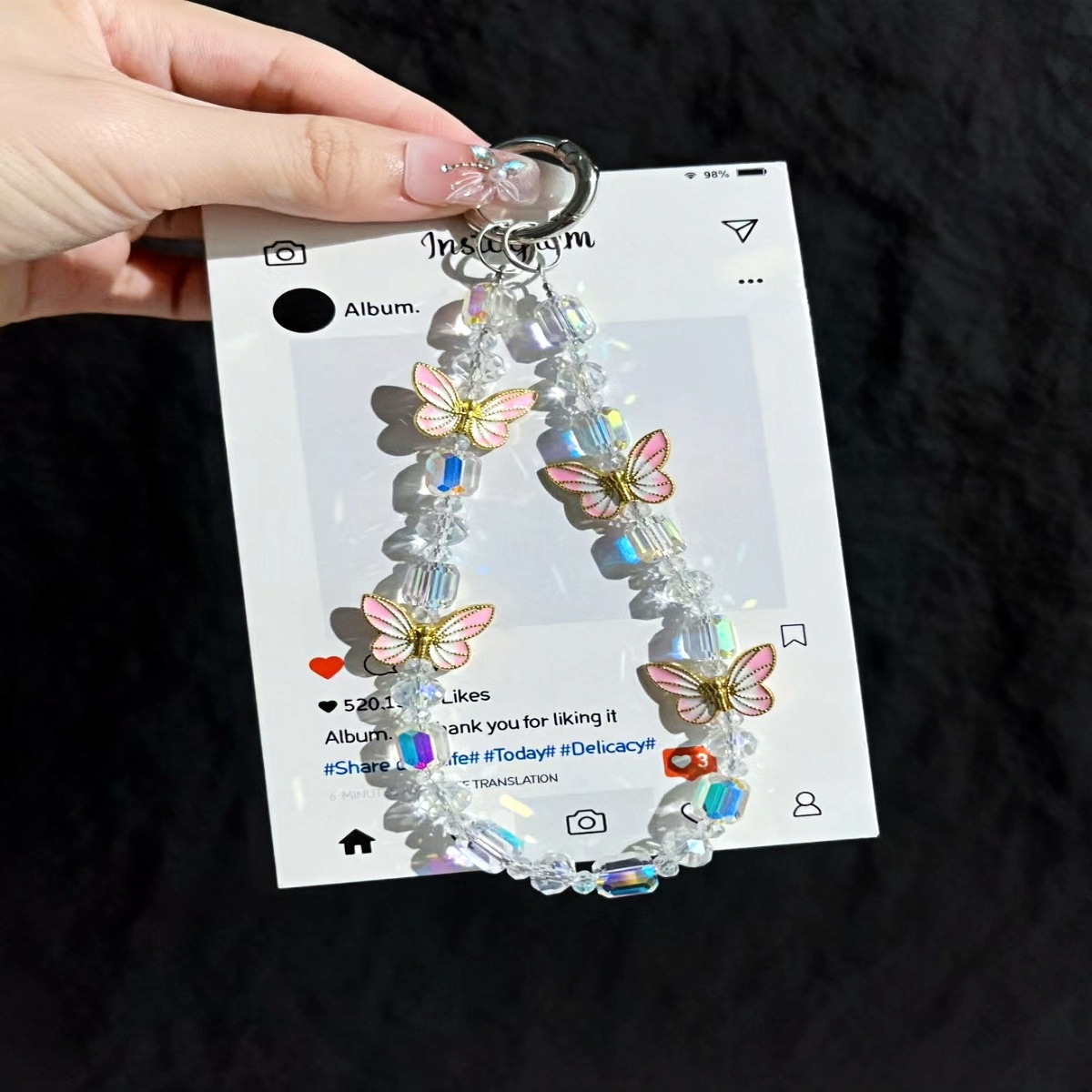 Cadena de teléfono móvil al por mayor cadena de cuentas de cristal flor de mariposa sentido de alta gama cadena corta hecha a mano para mujer bolsa de viento NIS todo fósforo