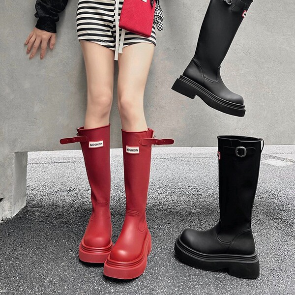 Red autumn high boots made of soft leather platform