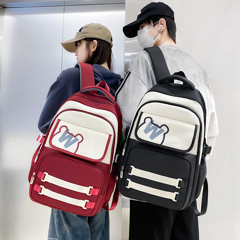 Mayorista nueva mochila de gran capacidad de moda simple campus mochila escolar de tendencia de carga mochila de viaje