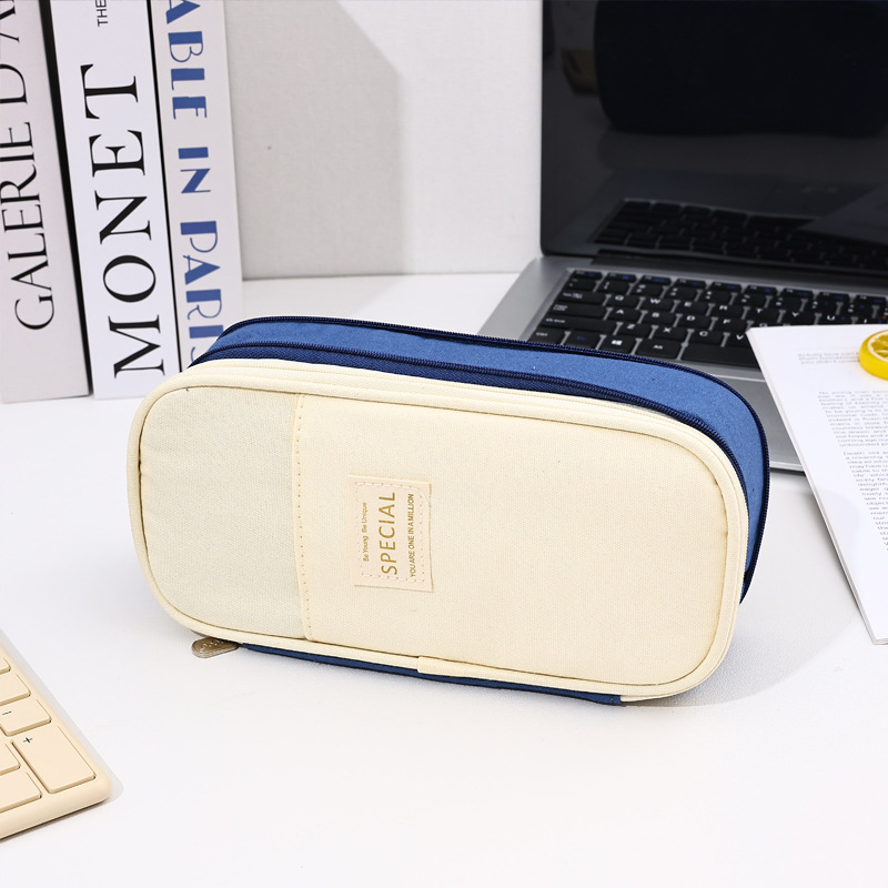 Bolso de lápices retráctil de lona de color de contraste de estilo explosivo transfronterizo Bolso de papelería de gran capacidad con doble cremallera simple multifuncional para estudiantes