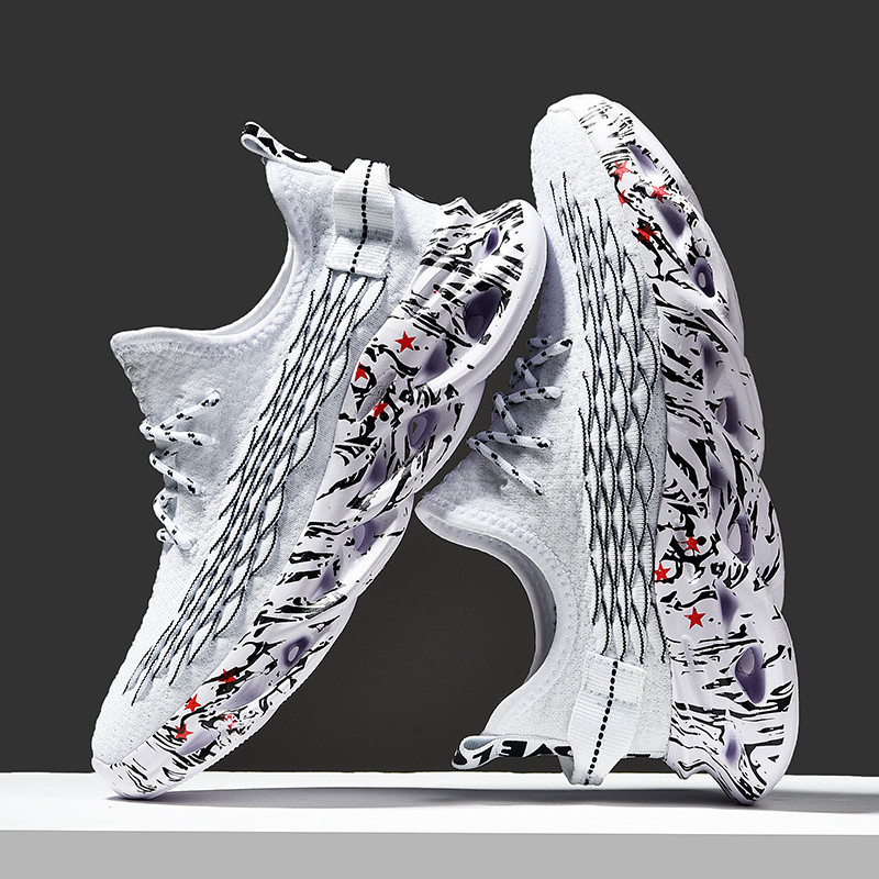 Side view of men's athletic running shoes showing blade sole technology