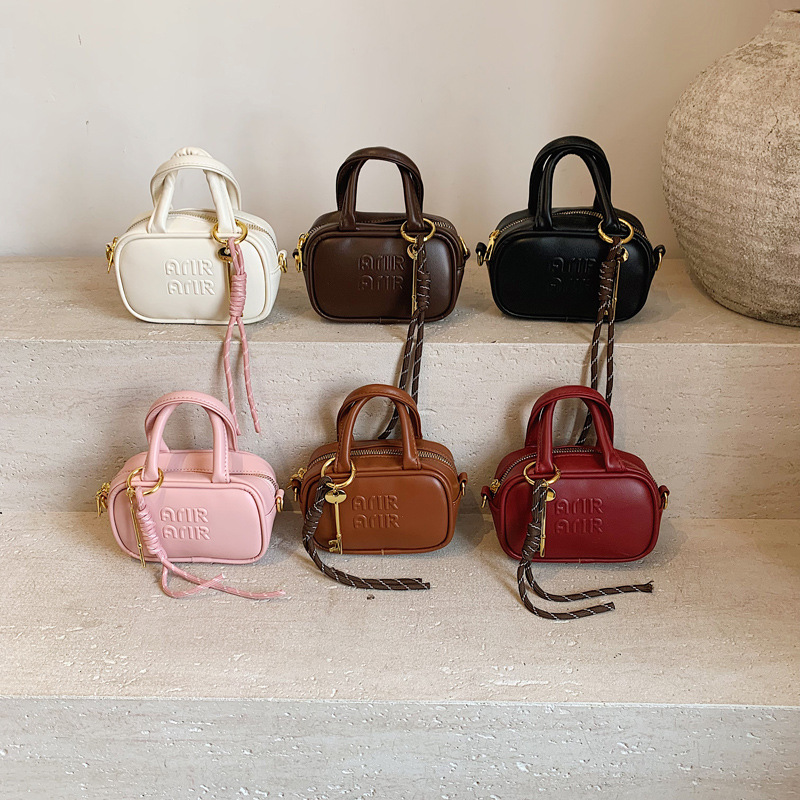 Bolso de hombro para niños y niñas con letras de estilo occidental, colgante de llave pequeña de moda, bolso de mensajero para bebé, nuevo mini bolso para niños