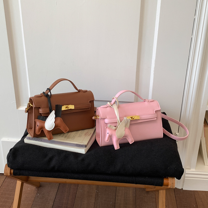 Texturas bolsos Kelly mujeres 2026 verano nuevo estilo de moda simple mochila diaria bolso de mano super caliente bolso pequeño