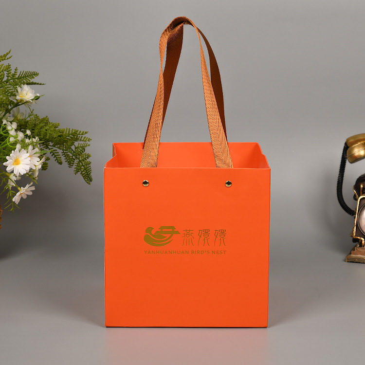 橙色白卡纸燕窝补品手提袋烫金礼品包装袋纸袋铆钉手提绳方底袋子