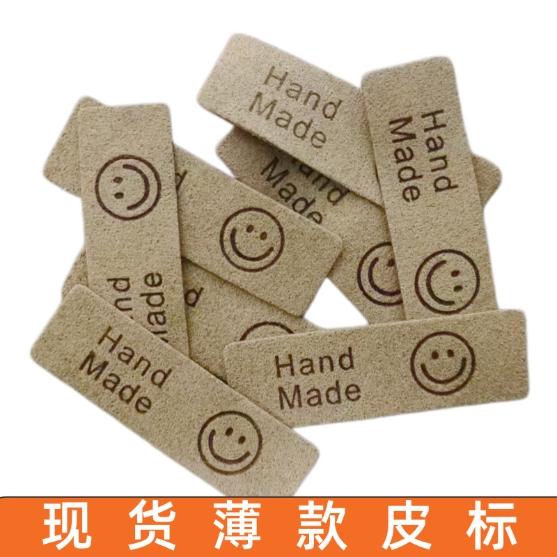 In-Stock Thin Smiley Face Leather Label, Ultra-Fine Fiber Embossed Clothing Accessories, Fashion Handmand Smiley Face Label with Logo In-Stock Thin Smiley Face Leather Label, Ultra-Fine Fiber Embossed Clothing Accessories, Fashion Handmand Smiley Face Label with Logo