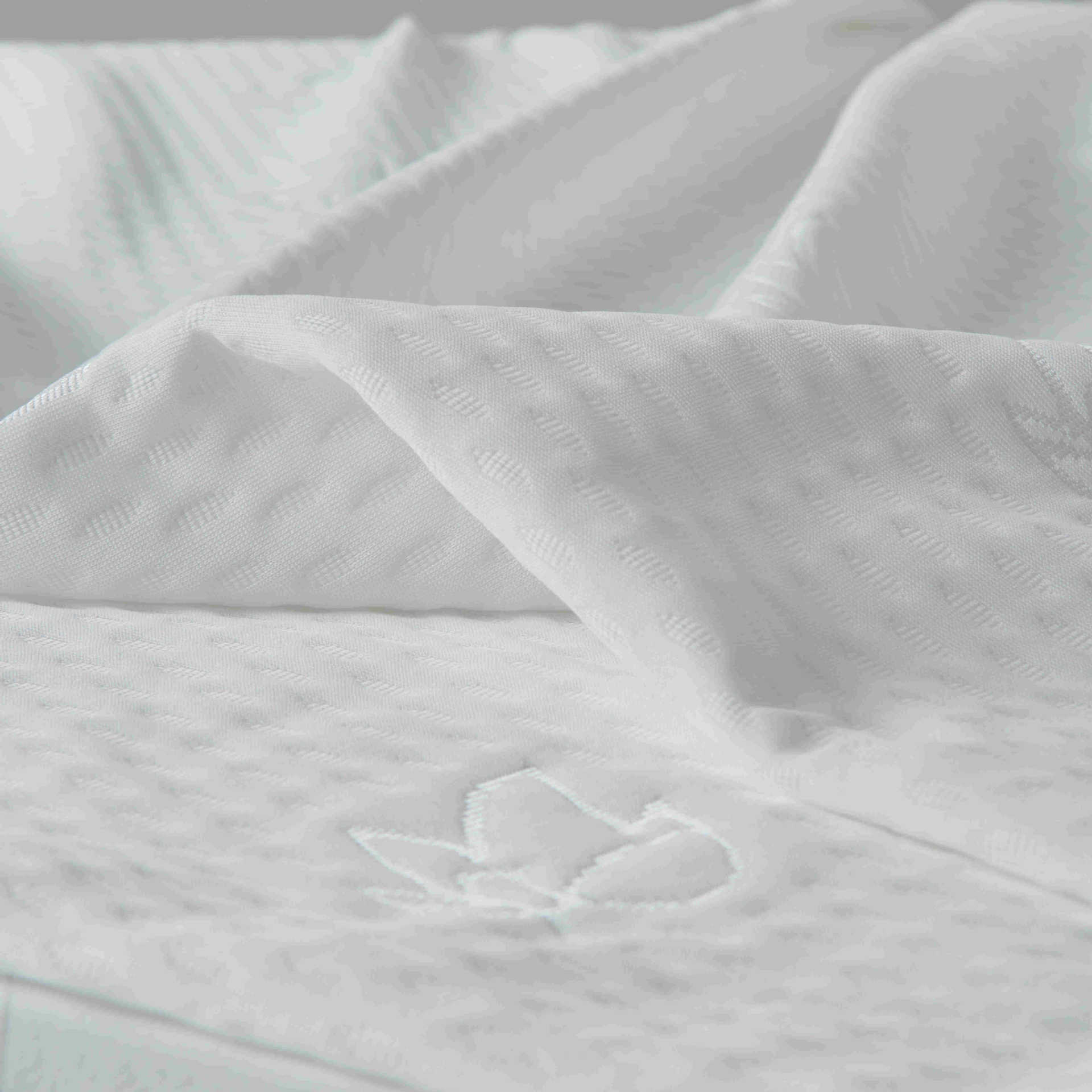 Blanco unilateral tejido Jacquard tela de colchón tela de punto ancho tela de lana abrasiva ropa de cama tela textil