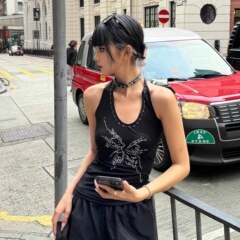 【モーデール】アメリカの小衆のレトロなギャルの蝶はドリルの黒色の首のサスペンダーの金を掛けて背を現してやせている上着を現します。