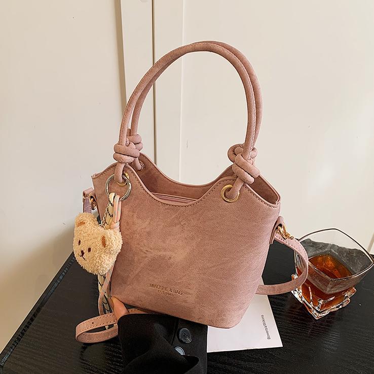 Corea del Sur ins moda bolso de cubo de mano 2025 nuevo estilo simple ocio versátil bolso de hombro textura superior