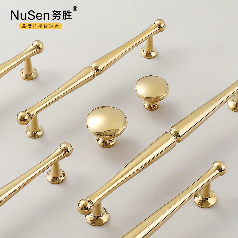 French light luxury brass cabinet handles with a bright gold Nordic modern minimalist single hole full copper cabinet door pulls