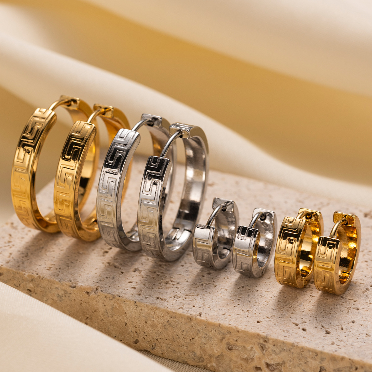 TENA Europa y América pendientes de acero inoxidable vacaciones nicho de diseño de textura de acero de titanio ligero lujo de alta calidad joyas para los oídos
