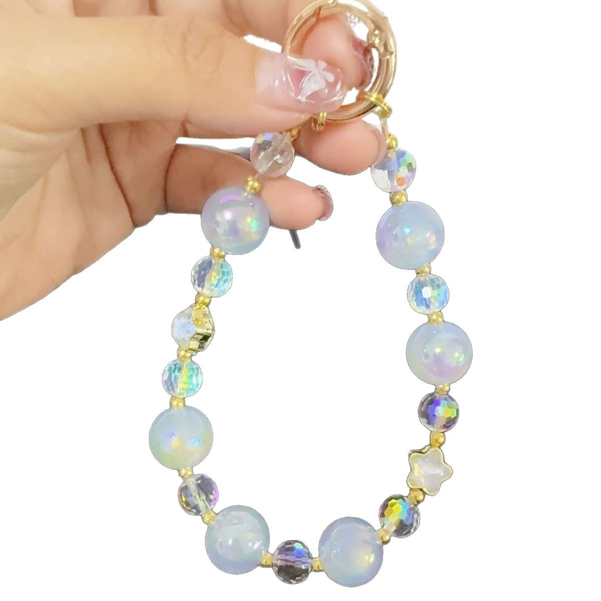 Mayorista cadena de teléfonos móviles sensación de alta calidad estereoscópica bola pentagonal llave colgante perla de teléfono móvil colgante pulsera nuevo