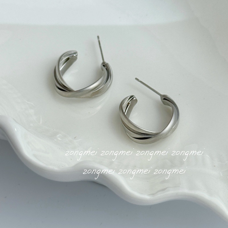 A pair of cement gray earrings