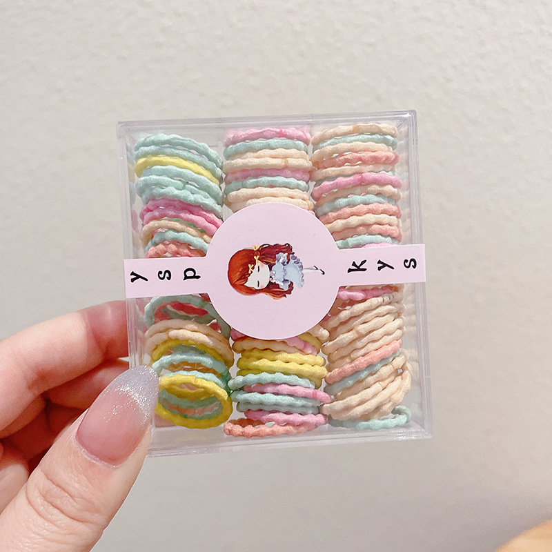 Bebés color caramelo de alta elasticidad pulgar anillo de cabello de niñas adornamiento de cabello de dopamina no daña banda de goma de cabello