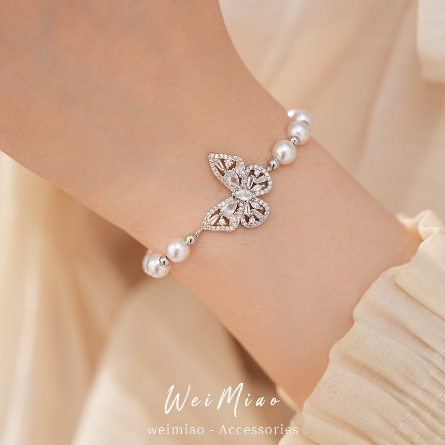 Brazalete de perlas mariposa con cuentas de diamante ligero lujo nicho pulsera de alta sensación temperamento exquisito joyería diaria universal