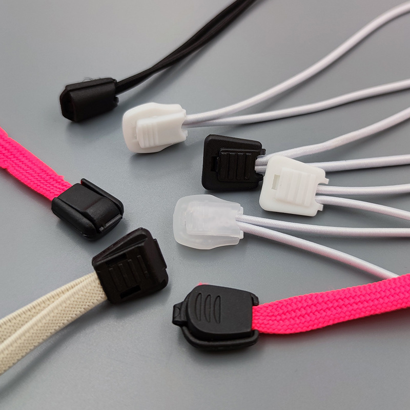 Plastic clip rope tail buckle shoelace zipper head umbrella rope clip file bag buckle elastic rope head buckle black and white through spot